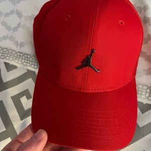 Adult sized Red JORDAN hat w/silver “Jumpman” logo NWOT